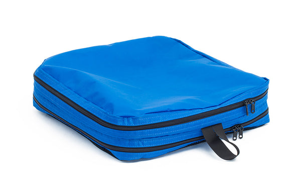 An empty and zipped closed Island (blue) Aether Large Aeronaut 30 Packing Cube showing the all-fabric side.